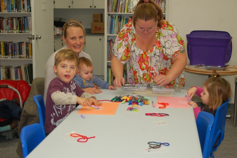 Having fun with crafts at the Come Grow With Me program, from left, were: Levi, Megan and Charis Maier, Teniel Larson, and Jayda Newton.