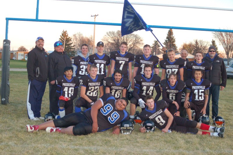 Members of the Preeceville Panthers football team, from left, were: (back row) Patrick Livingston and Jeremy Mattison (both coaches), Calum Livingston, Lee Schutte, Dreyton Paul, Spencer King, Connor Novak, Brad Steppan, Shawn Holowachuk and Doug King (coach); and (front) Sean Paligan, Hayden Strand, Dallas Papequash, Kole Statchuk, Bo Babiuk, Noah Tonn, Matthew Fenske and Jesse Johnson. Unavailable for the photograph were Jake Huska and Jalen Bayer.