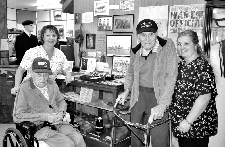 A group of eight residents of the Kamsack nursing home visited the Power House Museum last week when two of them were photographed at the veterans’ display. From left, were: Patty Witzko, a nursing home activity worker; Peter Popoff, who is to celebrate his 103rd birthday this month; Albert Tysowski, a veteran of the Second World War, and Karen Rubletz, an activity worker.