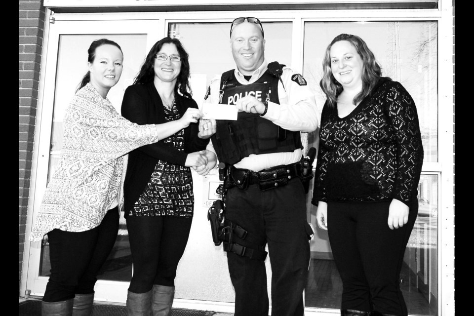 Last week, Cst. Brad Rumbolt and Terri Bouvier (right), the Canora/Sturgis RCMP detachment service assistant, made a $1,500 donation to the Child Action Plan in Canora and the SPE (SturgisPreecevilleEndeavour) Child Action Plan. Accepting the donation were Chelsey Exner (left), the director of leisure services for Canora, and Karolyn Kosheluk, the coordinator for the Family Resource Centre in Sturgis. The RCMP raised the funds mainly through the detachment’s annual golf tournament.