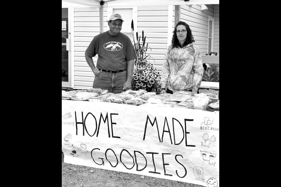 Tim and Alyssa Lukey had a lot of baking for sale at the Canora Farmers’ Market on Thursday.