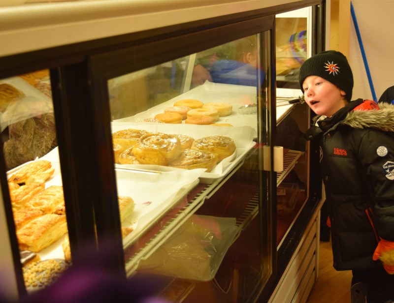 As a student in Chantel Kitchen’s pre-Kindergarten class at Victoria School, Reed Woodworth was among the students who toured the Prairie Grain Bakery and Deli in Kamsack last week when he found some very interesting pastries in a display case.