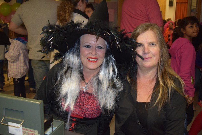 Tending the admission table at the KCI Fun Night on October 27 were Jane Hoy and Lorraine Chutskoff.