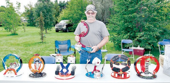 Eugene Keyowski made the set of unique trophies for each category in the Cruisers’ Car Club show and shine on Saturday and Sunday. The trophies are made from vehicle parts.