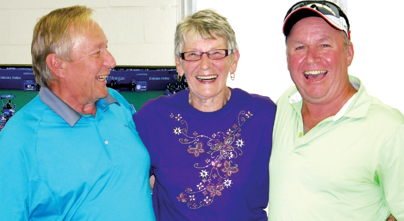 Glen Sterzer (left) and Darryl Binkley (right) of Kamsack won the men’s championship fl ite of the Canora Seniors’ Golf Tournament on Friday. Making the presentation was Eleanor Murray.
