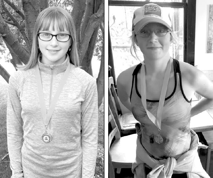 Winning silver medals at the Run for Peace cross-country competition held at the Cherrydale Golf Course in Yorkton on September 9, from left, were: Kira Kitsch, left, and Maija Rousseau.