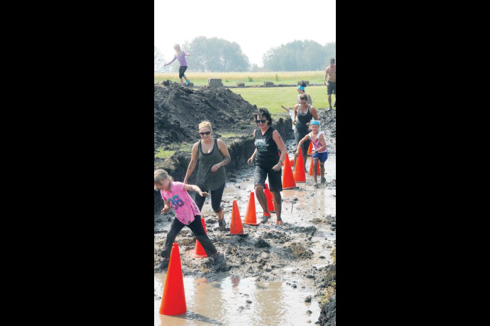 The youngest participants were the first to go through the 1.25 kilometre course, ﬁ lled with muddy obstacles, but before the end of the day parents and numerous adults joined them for the mudder obstacle course challenge on Saturday. From front to back were: Jordan Harper , Kylee Toffan,  Gina Rakochy, Miaha Ruff, Aimee Ruff, Sara Kozmanuik and Justin Ruff.