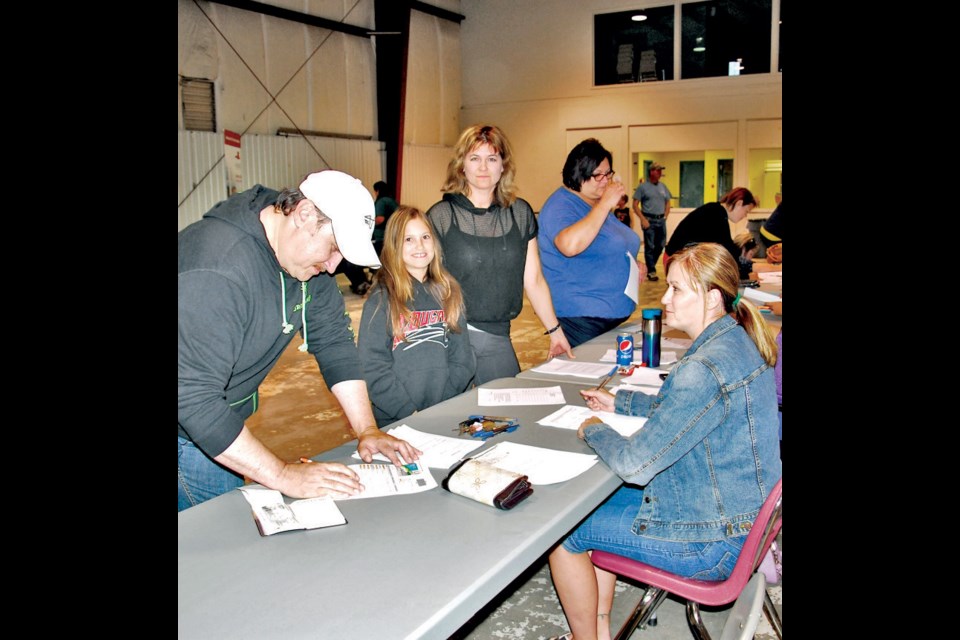 Mervin and Gladys Secondiak were signing up their daughter Teagan for the Canora Minor Hockey Association on Thursday.