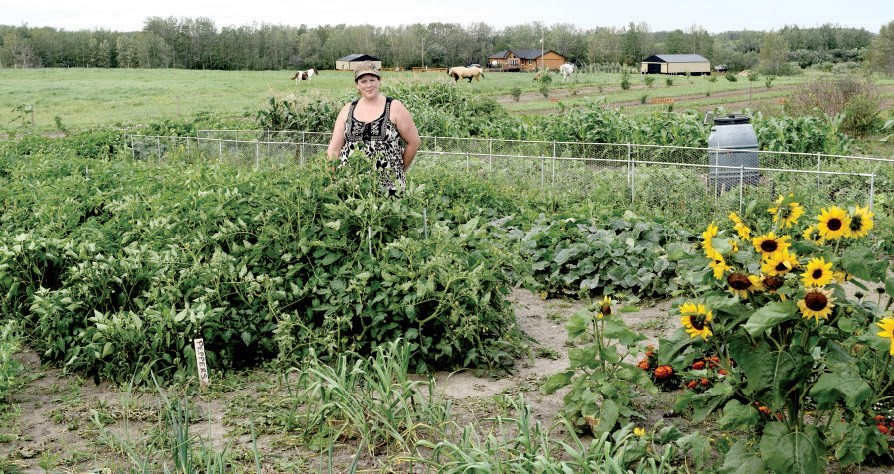 Wendy Becenko tends a large garden