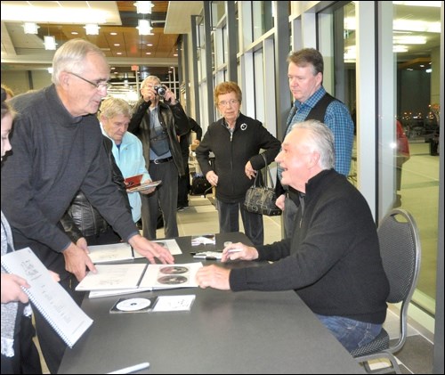 Following his concert at the Dekker Centre, Frank Mills signed autographs for a good portion of the audience that gave him three standing ovations. Photo by Jayne Foster