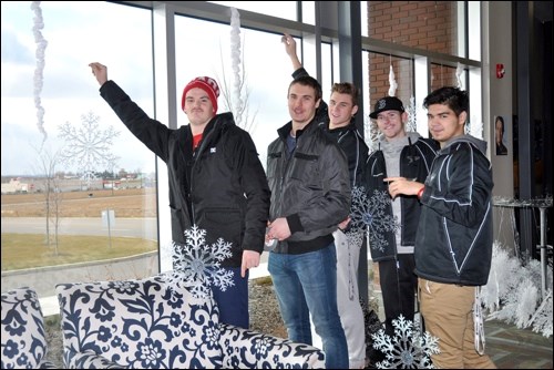 The Battlefords North Stars are in charge of hanging snowflakes. As hockey players, they are certainly all familiar with ice, but how familiar are the California natives with snow? Photos by Jayne Foster