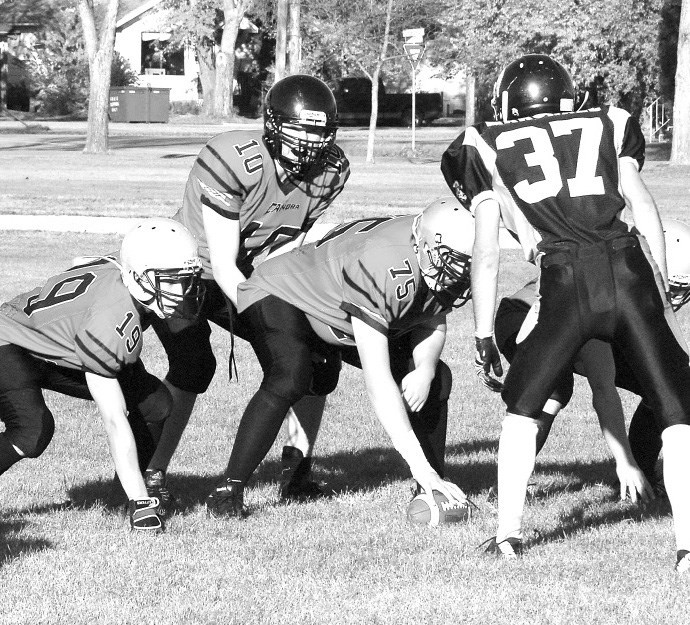 Getting ready to start the play were: Kyle Strelioff (quarterback) with Glen Teslia and Tristen Morozoff out front.