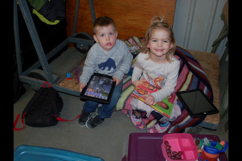 Preston Walter and Ellie Hayes couldn't be bothered with all the shopping chaos on Saturday at the Kinette Craft and Trade Show. They found a small, unused corner they turned into their own amusement space on Saturday morning.