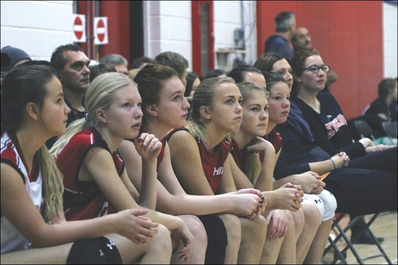 Watching their teammates intently are (left to right) Hapnot players Julie Finnie, Alyssa Patterson, Emily Dadson, Kalena Kittle, Hannah Baynton, 
Anna Krassilowsky, and coaches Amy Olenick and Maggie Ryan.