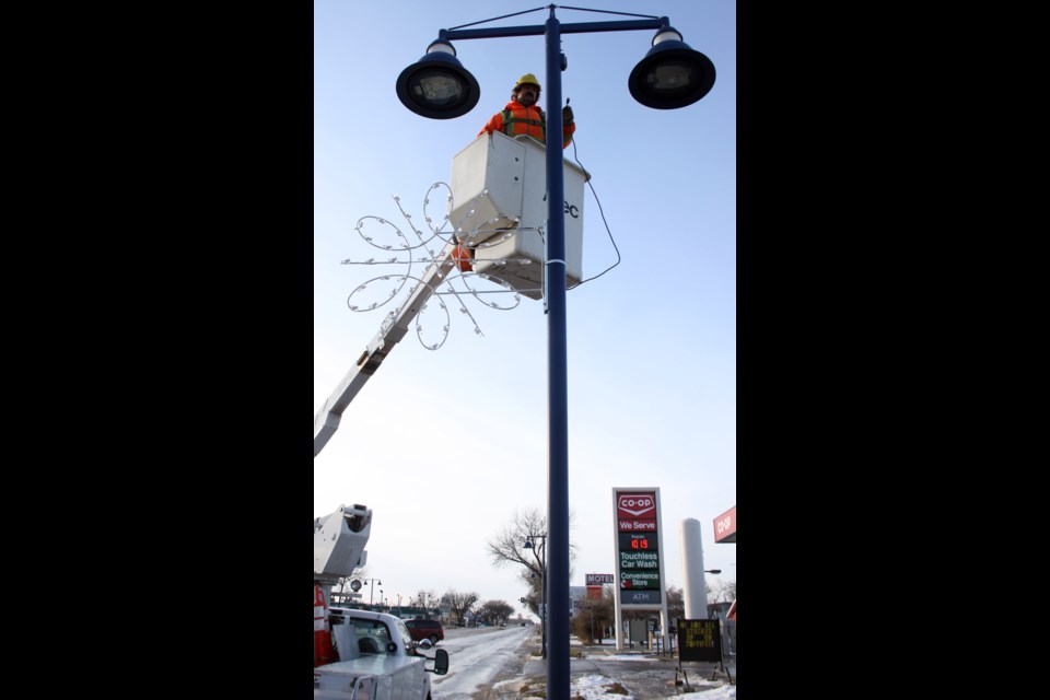 Deck the streets City workers have been busy hanging the seasonal decorations along Broadway Street. The festive look is just in time for the annual Christmas Parade schedule for Saturday. The parade is always popular as Old Saint Nick is likely to take part.