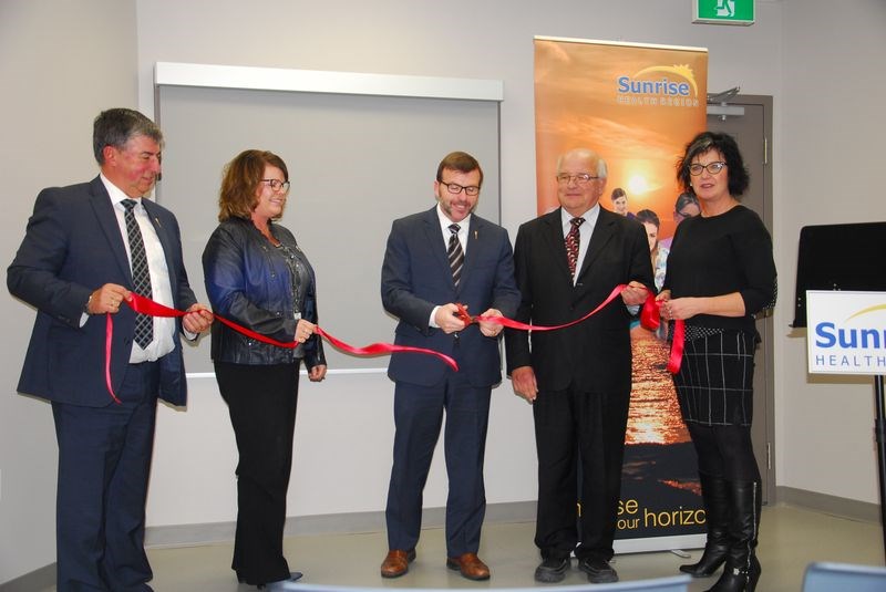 From left, taking part in the ribbon cutting ceremony to officially open the Canora Health and Wellness Centre on November 19 were: MLA Ken Krawetz, Sunrise CEO Suann Laurent, Greg Ottenbreit (Minister responsible for Rural and Remote Health), Lawrence Chomos (Sunrise board chair) and Mayor Gina Rakochy.
