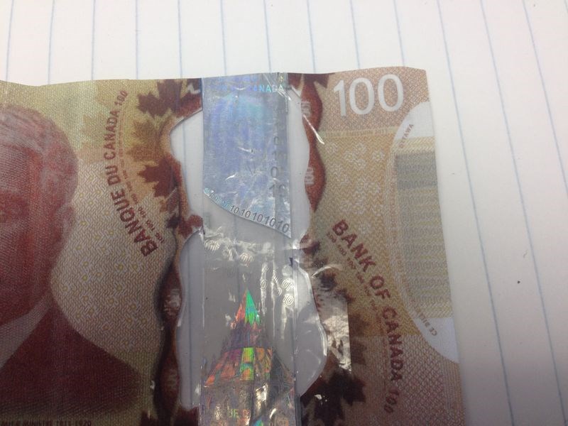 Pictures of fake $100 bill.