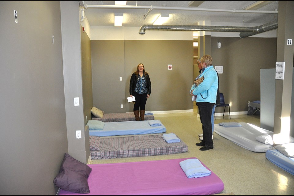The Lighthouse Serving the Battlefords manager Caitlin Glencross, left, takes a group through the men’s dormitory on a tour of the facility recently. Photos by Jayne Foster
