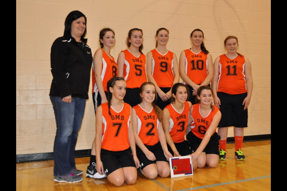 The St. Mike's Tigers, with back row from left, coach Claire Fingler, Meagan Dutchak, Alyssa Romanovitch, Emma Bitz, Jillian LaBatte, Chalene Lascelle; front, Brynn Romanovitch, Sydney Spencer, Hailey Neiszner and Sydney Meyers, went undefeated at the Elecs Jr. Girls Invitational Basketball Tournament at Estevan Comprehensive School on Saturday.