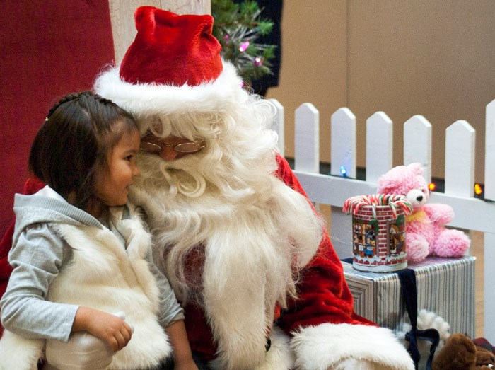 Memory with Santa Camera shy Vida-Lynn Stevenson begins to warm up to the camera after sharing an inside joke with Santa Saturday afternoon. Photos with Santa are available at the Parkland Mall Fridays and Saturdays from December 11-19. Portraits are provided by Springers Gymnastics Club.