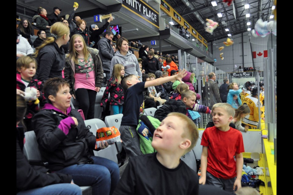 The hundreds of kids who lined the Affinity Place stands at the CanElson Drilling Estevan Bruins game against the Kindersley Klippers last Thursday had to wait 50 minutes and 11 seconds before Bruins' forward Owen LaClare scored the opening goal of the game, allowing the kids to throw a record 1,236 stuffed animals onto the ice in the Estevan Mercury sponsored third annual Teddy Bear Toss. All of the toys and any donations made during the game goes to the Salvation Army to then be given to families during the Christmas holidays.