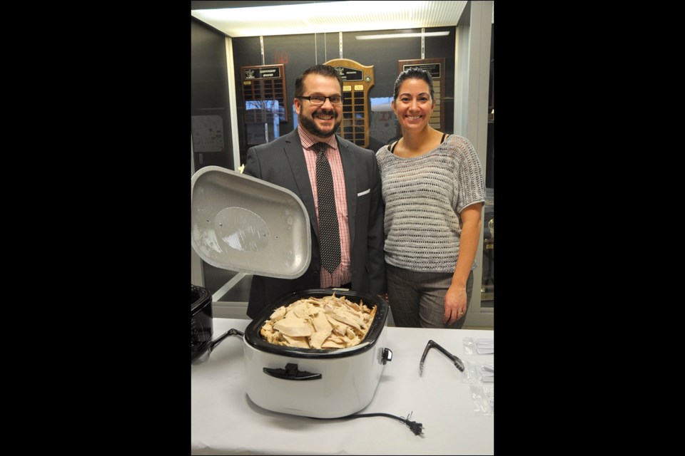 Mike Nord, general manager for Discovery Co-op, and Battleford Central School’s principal, Monique Sommerfeld, ready to serve turkey. See more photos on Page 18. Photo by Jayne Foster