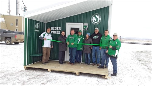 Battlefords Trail Breaker members and sponsor representatives celebrate the grand opening of Saskatchewan’s first Roughrider-themed warm up shelter. The ceremony took place at Charabin Seed Farm Thursday before the shack was moved to its location along the trail Friday. In the photo are Doug Noble, Mike Nord, general manager of Discovery Co-op, Dale Woytiuk, Laurier Chasse, Nicole O’Driscoll, Dale Charabin, Tim Schultz and Ken Willie. Photos by Dustin Saracini
