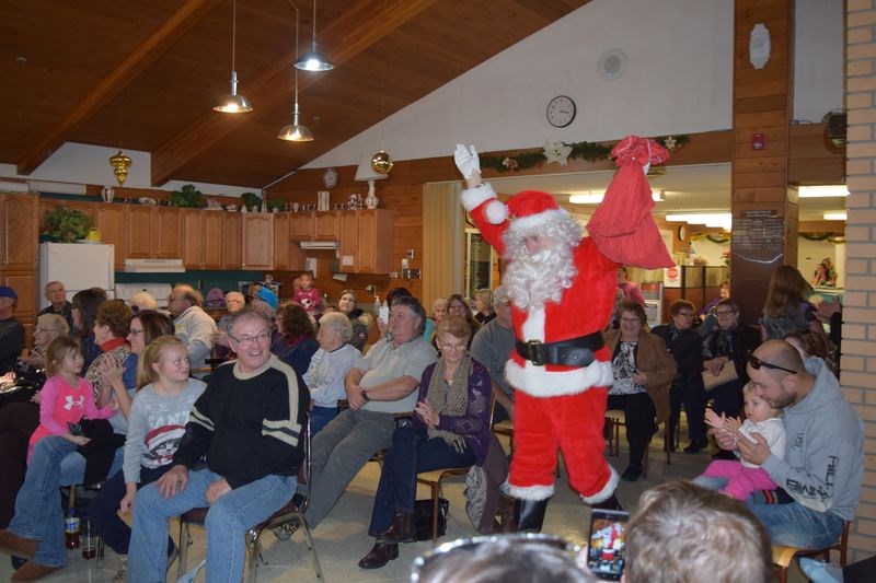 The crowd cheered as Santa Claus entered the Kamsack nursing home common room on December 5 when the home held its annual Christmas party.