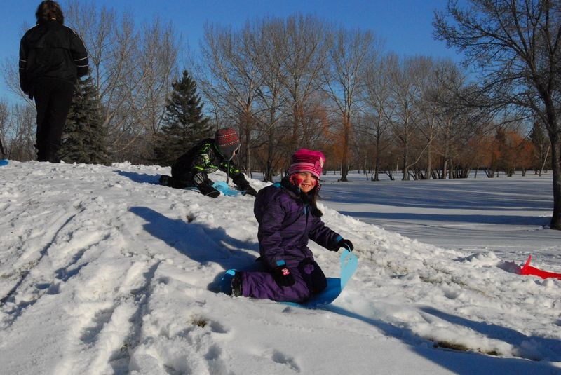 A large percentage of the approximately 150 children attending the Children’s Carnival in and around the Activity Centre on December 5, had fun sliding down a snow hill on a Crazy Carpet.