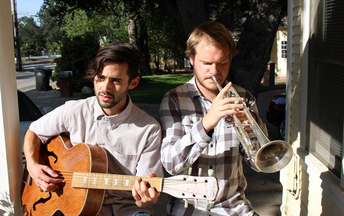 Julian Beutel, right, and his friend Travis Meador play on their porch in Newhall, California in Spring 2014.