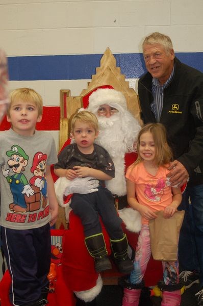 Floyd Neilson had his photograph taken along with his grandchildren and Santa at the Skate with Santa event at the Preeceville Arena on December 11. From left, were: Alex, Jaxon, Savannah and Floyd Neilson.