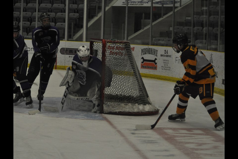 Estevan TS&M bantam AA Bruins' Cale Adams emerges from behind the Sask Valley Vipers net at Affinity Place on Sunday.