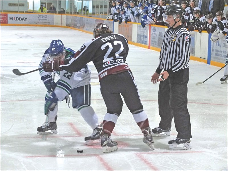 Flin Flon Bombers centreman Tyson Empey battles Melfort’s Travis Mayan for the post-faceoff puck during the Bombers’ 6-5 win over the Mustangs on Friday, Jan. 8. Flin Flon management made only one minor move on trade deadline day, confident that the red-hot club can continue its magic in the post-season.