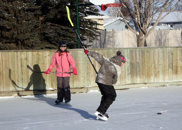 A little shinny on the outdoor rink at Weinmaster Park.