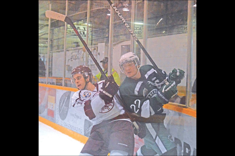 Kristian St. Onge of the Bombers collides with Branden Scheidl of the Klippers during an October game at the Whitney Forum.