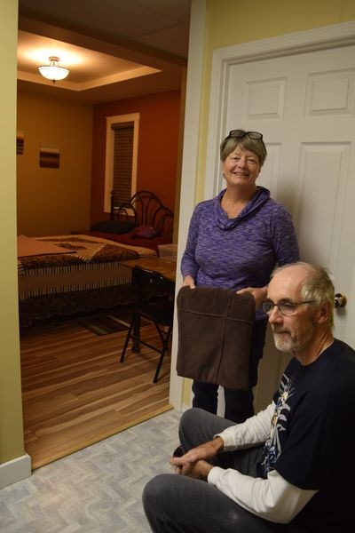 Brenda and Warren Andrews of Cote Siding were photographed in the sitting room which is off the bedroom in a private suite in their home which they are preparing to rent on a daily basis.