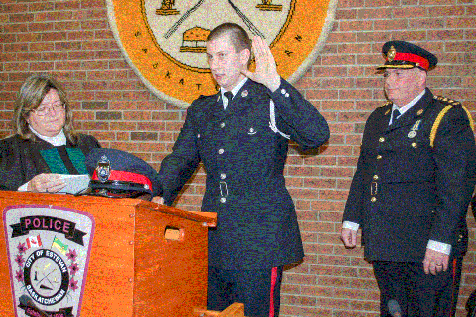 New constable Garth Mostowich was sworn into his new position on Friday evening by Justice Karen Hirsch and later received his EPS badge from police chief Paul Ladouceur.