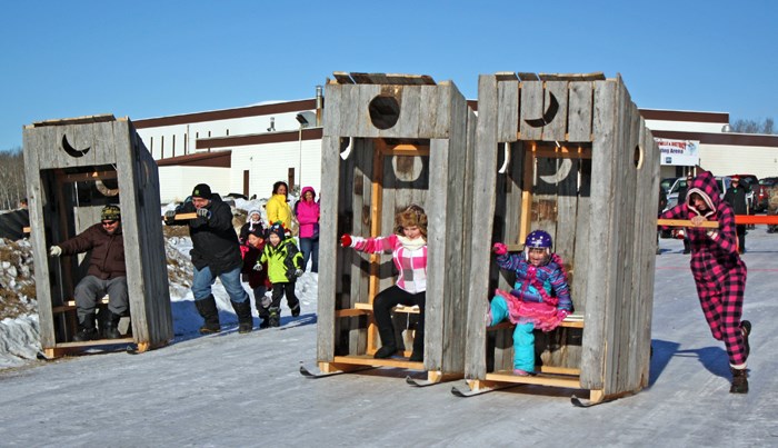 Flat out out house While the dog-sledders were out on the trails during the Mushers Rendezvous in Preeceville on Saturday, the community had some fun with outhouse races. The annual event features dogsled racing, of course, but also tree stump curling, tobogganing, various games for children and a banquet. See more photos in related story Mushers Rendezvous.