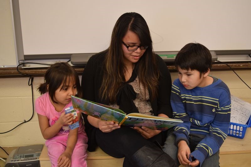 Among the persons to read to Victoria School students on Family Literacy Day was Justine Severight, a student teacher. With her were Sylvia Cote and Ethan Papequash, who are Grade 1 students.