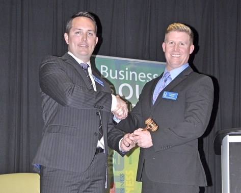 Outgoing president Brendon Boothman hands over the gavel to Jay Bottomley as new president of the Battlefords Chamber of Commerce. The Chamber held its 110th President’s Banquet at the Gold Ridge Centre Tuesday. Photos by John Cairns