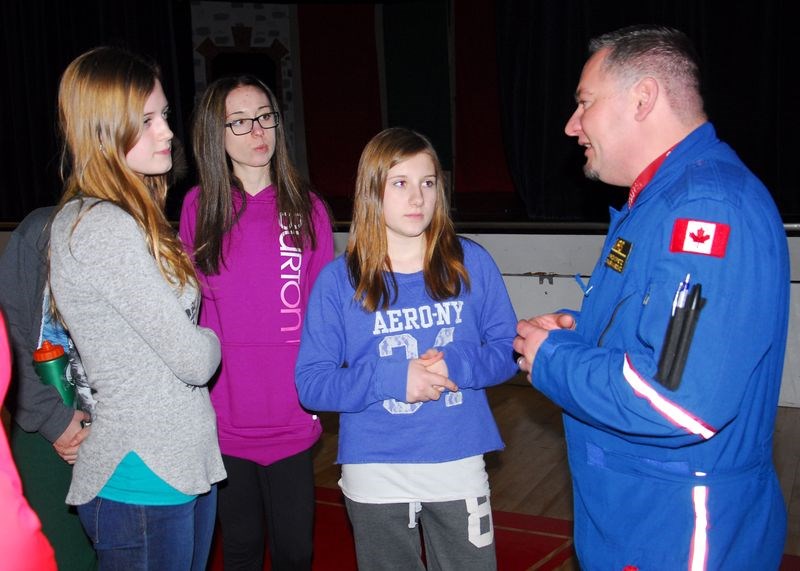 From left, Megan Barteski, Breanna Semeschuk and Emma Mykytyshyn had a few more questions to ask Jason Prokopetz, a STARS paramedic, following his presentation at Canora Composite School on January 13.
