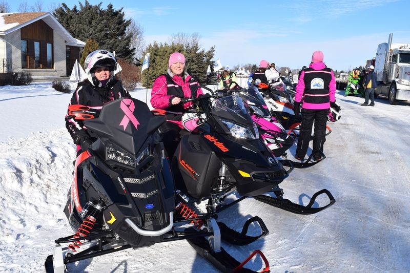 Holly Hudye, left, of Norquay and Kelly Kim Rea of Pelly were included in the group of 10 women who spent last week on snowmobiles, travelling from Prince Albert to Broadview, helping to raise awareness of breast cancer and the joys of snowmobiling. They were photographed as the group arrived in Canora for lunch on February 2.