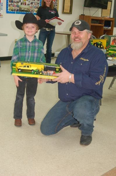 Jesse Beatty, left, was presented with the first-place award in the weepee barrels during the Etomamie Valley awards day on January 22. Brent Walker made the presentation.