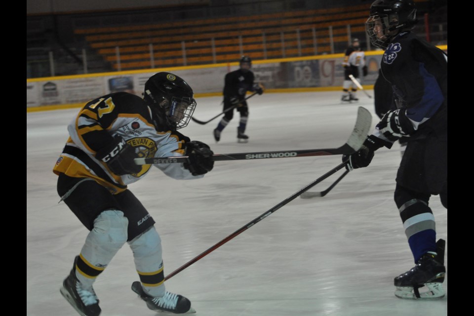 Bruins forward Turner McMillen takes a shot on the Broncos’ net.
