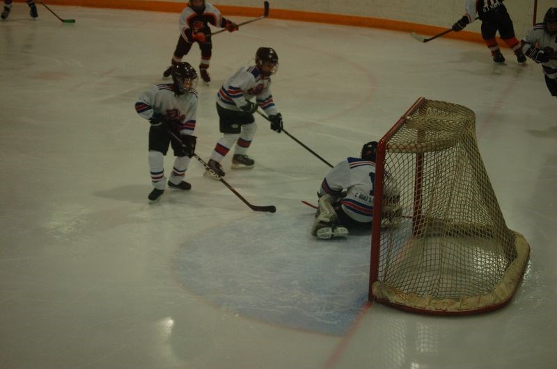 Camron Secundiak, left, and Kaiden Masley helped save the puck from sliding across the goal line as Lexluv Acosta was in net during the peewee second provincial game against Wadena on January 27.