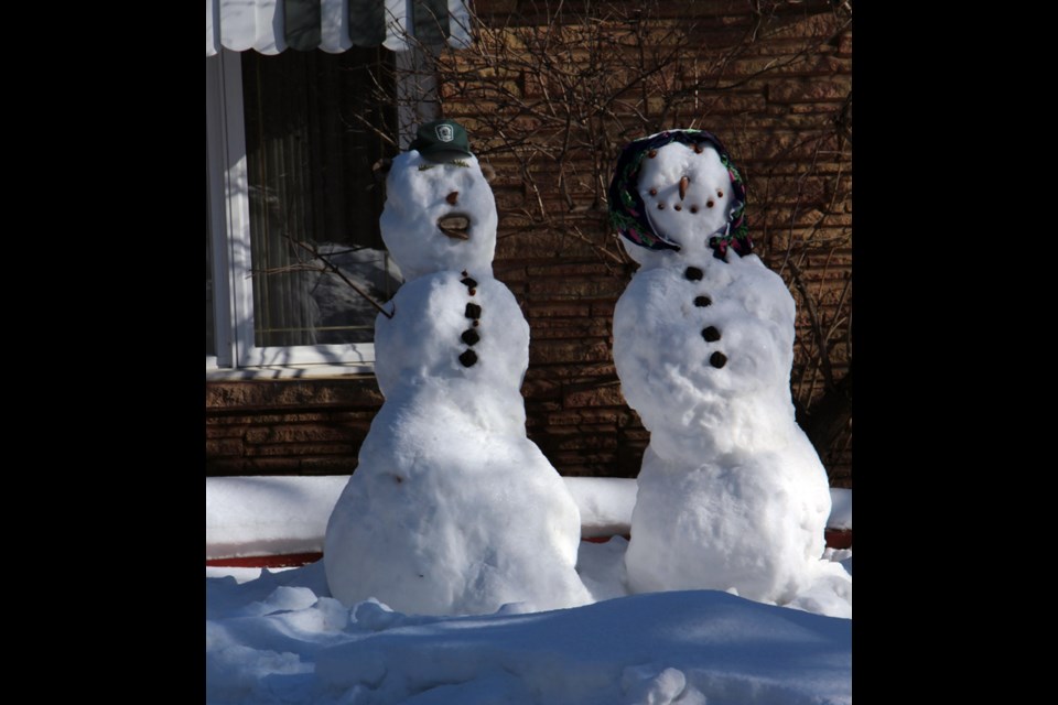 With warm weather and plenty of snow left around, it’s the perfect time of year to make yourself a snowman, just like this family on Third Avenue did.