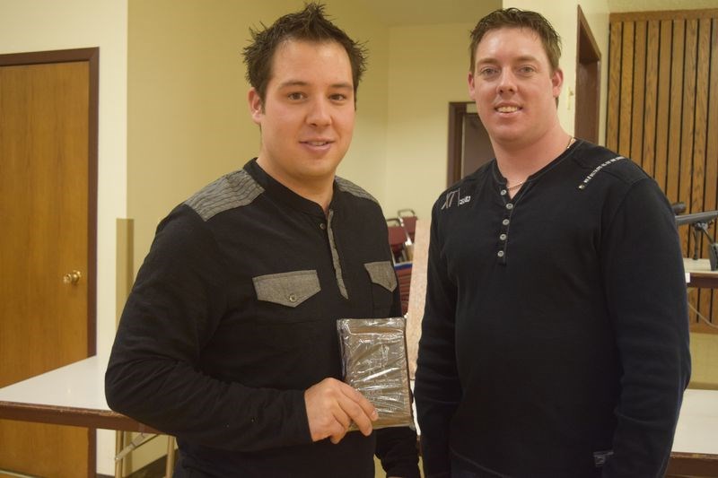 Drew Werboweski, left, received the award for having had the second-best non-typical white-tailed deer in the men’s category for an animal that measured 147 6/8 points. Making the presentation was Tyson Leis.