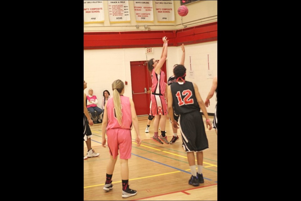 The action had a pink theme as the Unity Composite senior girls’ and boys’ teams hit the courts for a breast cancer fundraiser Feb. 26. Photos by James Herrick