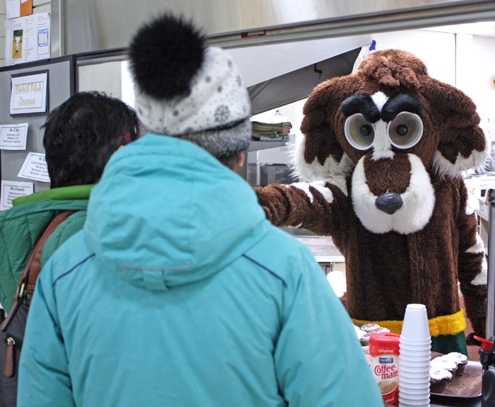 Class of 2020 welcome St. Bernard, Sacred Heart High School’s mascot serves up cupcakes, juice boxes and coffee during the school’s annual Grade 8 open house March 7. At the event, potential students and their parents get a look at the various academic programs and extra-curricular activities available to them next year when they enter secondary school. In addition to booths for classes, clubs and sports, the current students put on sports demonstrations and musical performances for the elementary students and their parents.