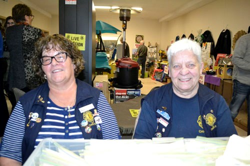 Lions members and volunteers Pat Anderson (left) and Myrla Holland (right) joined forces to help make the Carlyle & District Lions Club's fundraising supper, raffle and auction a reality. The event, in its 25th year, has raised over $500,000 to benefit area communities.